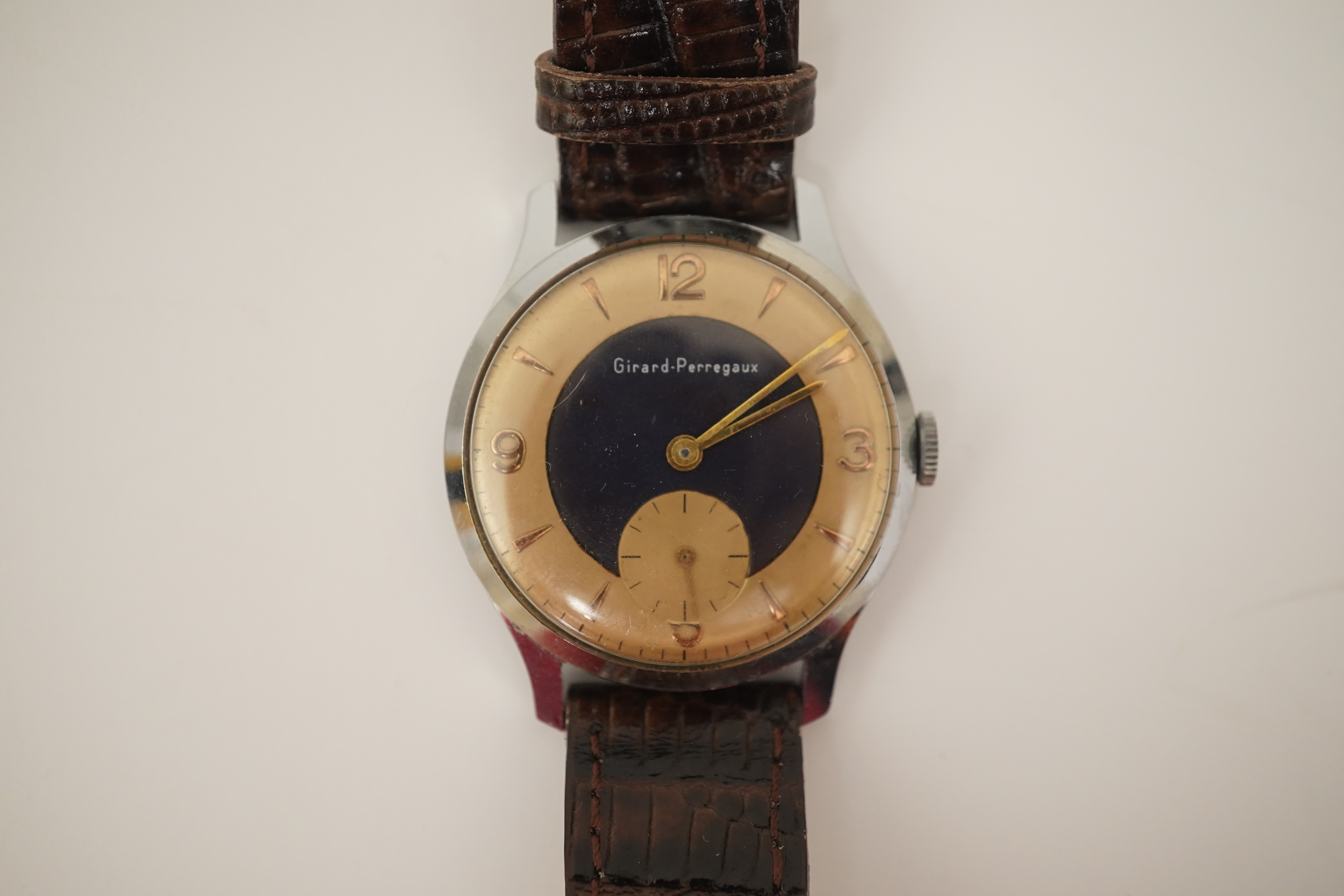 A gentleman's stylish 1960's stainless steel Girard Perregaux yellow and blue dial manual wind wrist watch